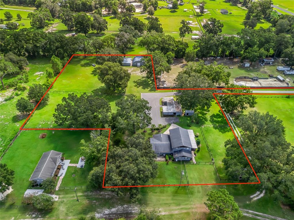 10291 Highway 40 Ocala, FL 34482 - Photo 17 of 21 an aerial view of a house with a yard and lake view