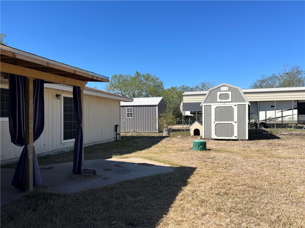 24748 County Road 350 Mathis, TX 78368 - Photo 13 of 16 a front view of a house with a yard