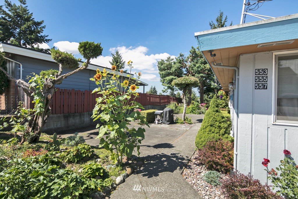 555 Index Place Northeast Renton, WA 98056 - Photo 4 of 4 a front view of a house with a yard