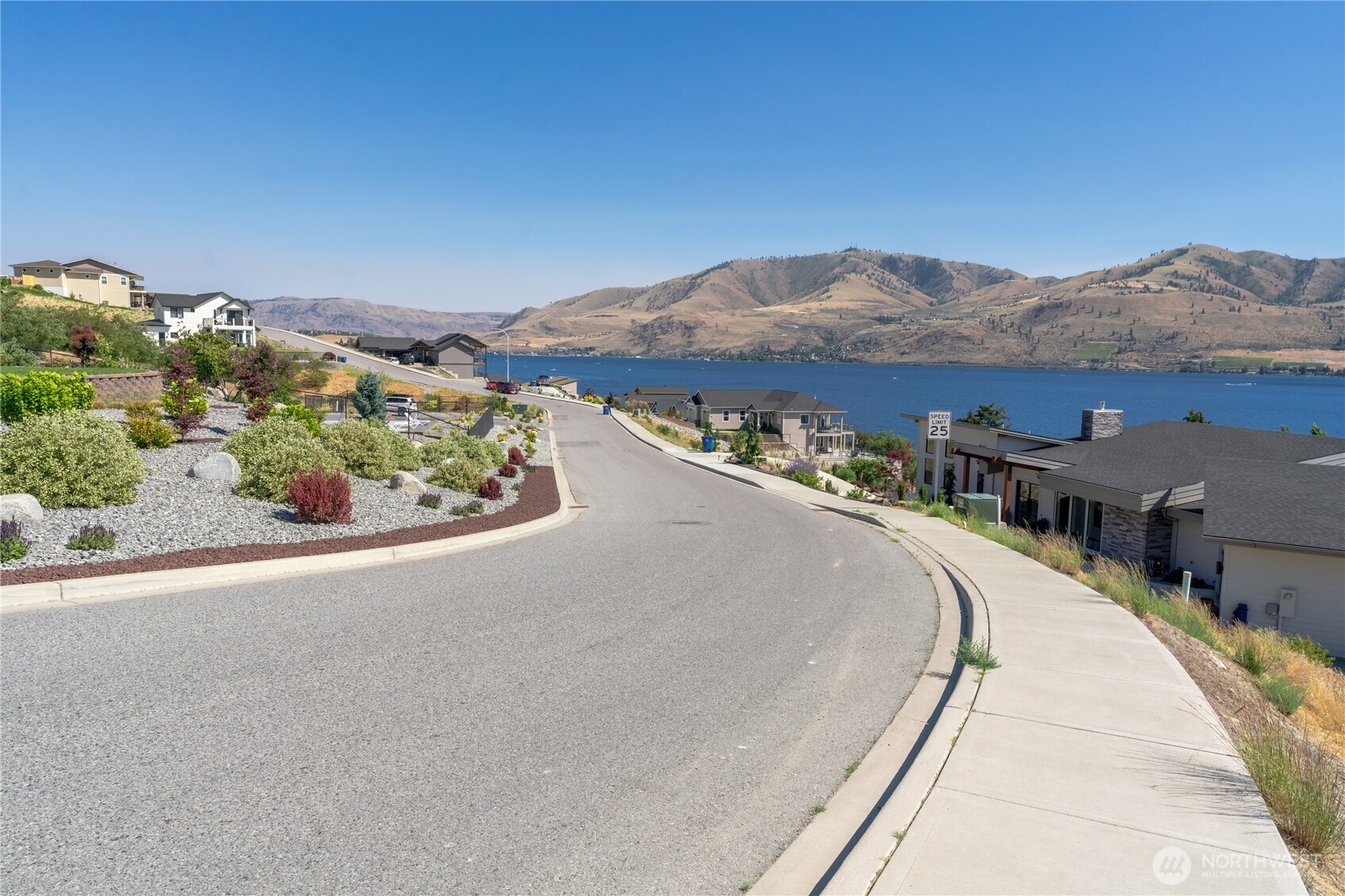 209 Apple Avenue Chelan, WA 98816 - Photo 18 of 28 a picture of a city and mountain view