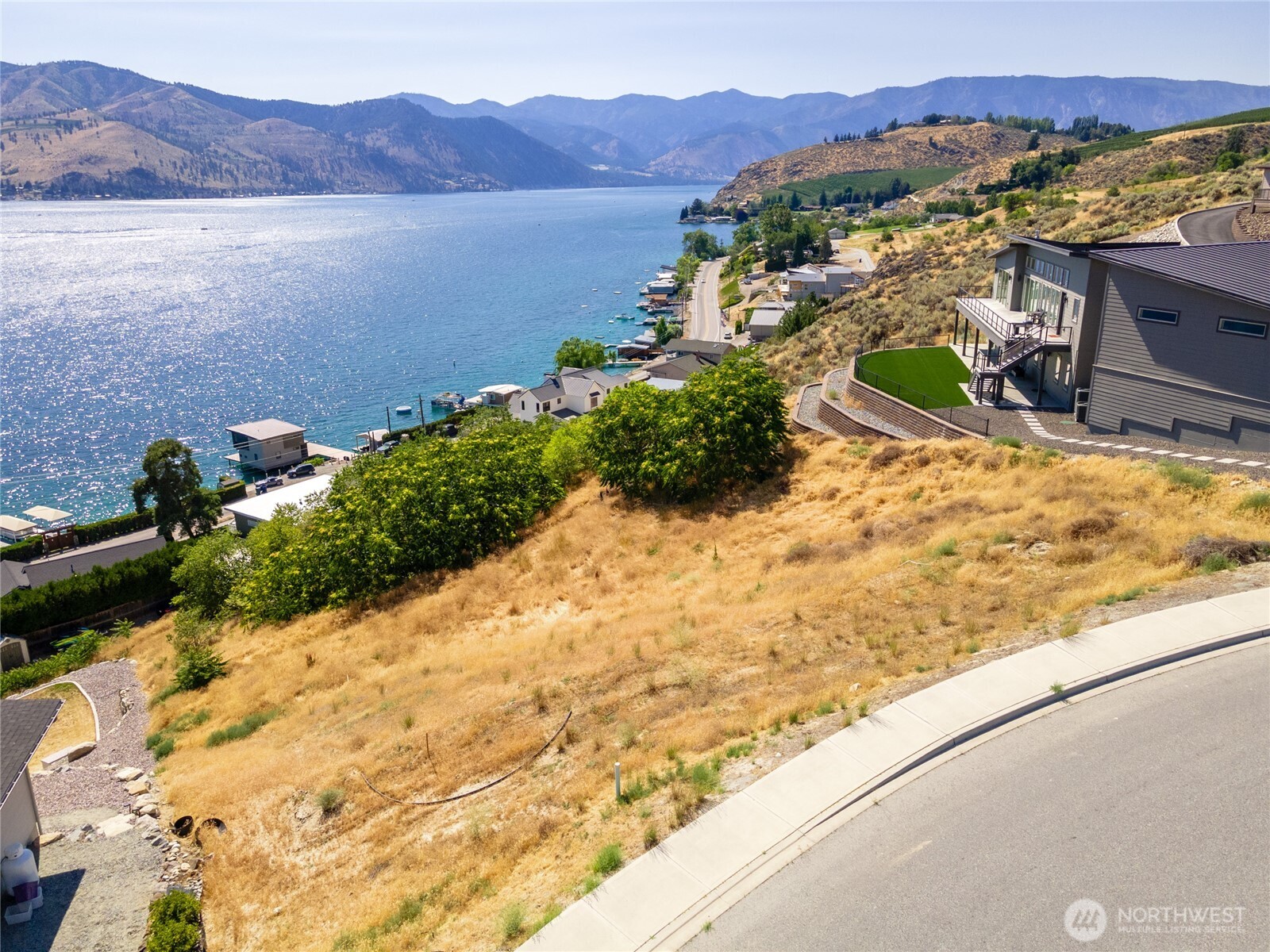 209 Apple Avenue Chelan, WA 98816 - Photo 20 of 28 a view of a lake with a mountain