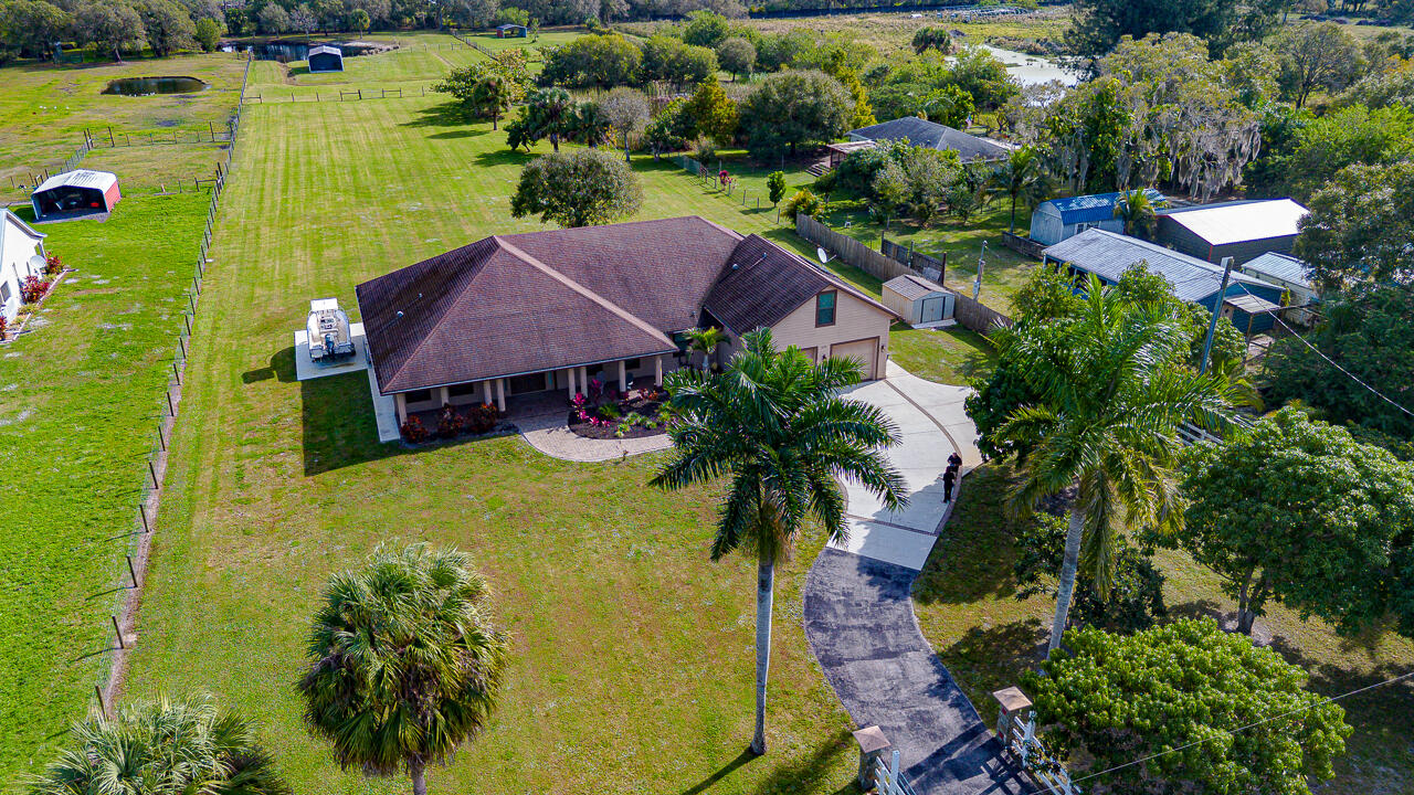 2774 Gentile Road Fort Pierce, FL 34945 - Photo 4 of 70 an aerial view of residential houses with outdoor space and swimming pool