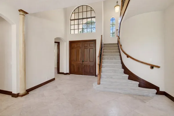 a kitchen with stainless steel appliances granite countertop a refrigerator a sink a stove a microwave and island