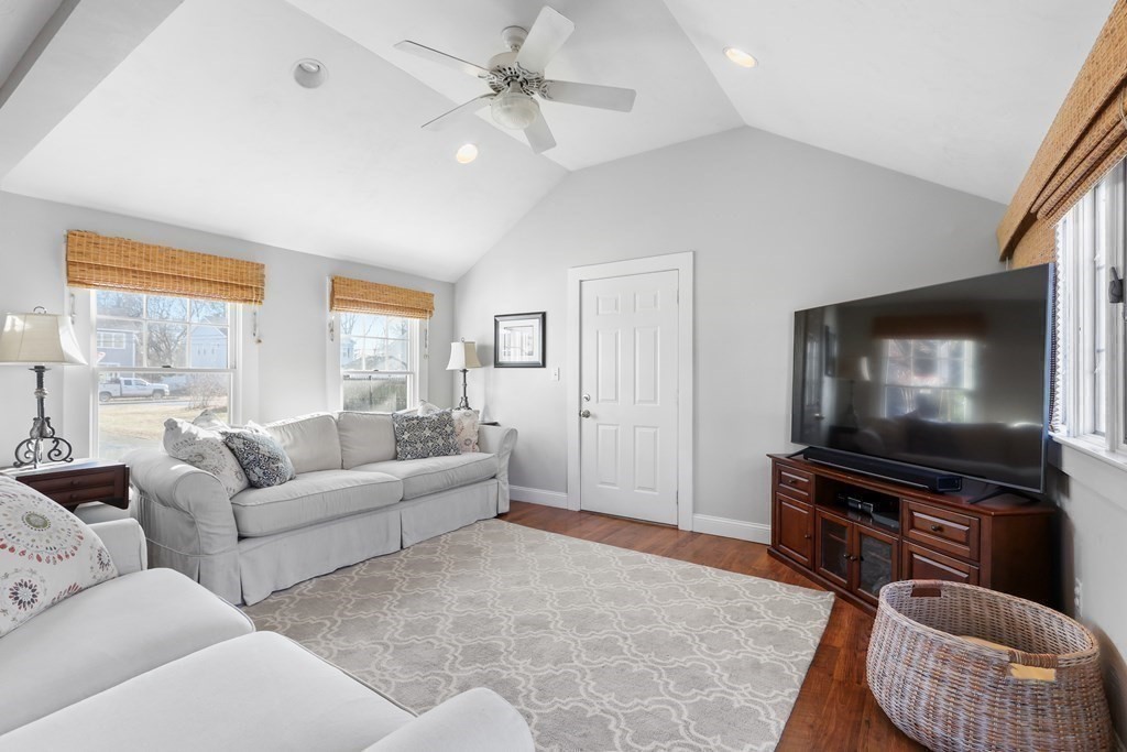 79 Kendall Lane Natick, MA 01760 - Photo 11 of 32 a living room with furniture and a flat screen tv