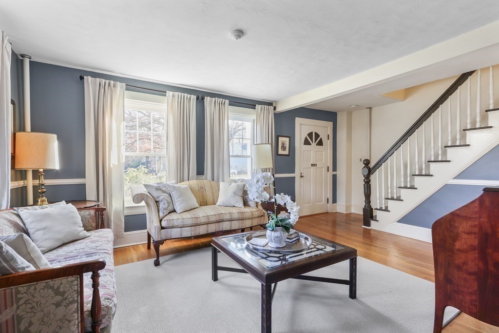 79 Kendall Lane Natick, MA 01760 - Photo 16 of 32 a living room with furniture and a table