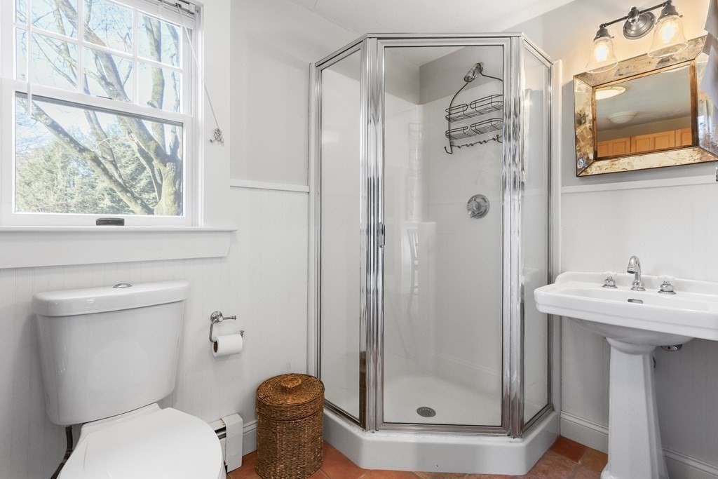 79 Kendall Lane Natick, MA 01760 - Photo 18 of 32 a bathroom with a shower a toilet and a sink