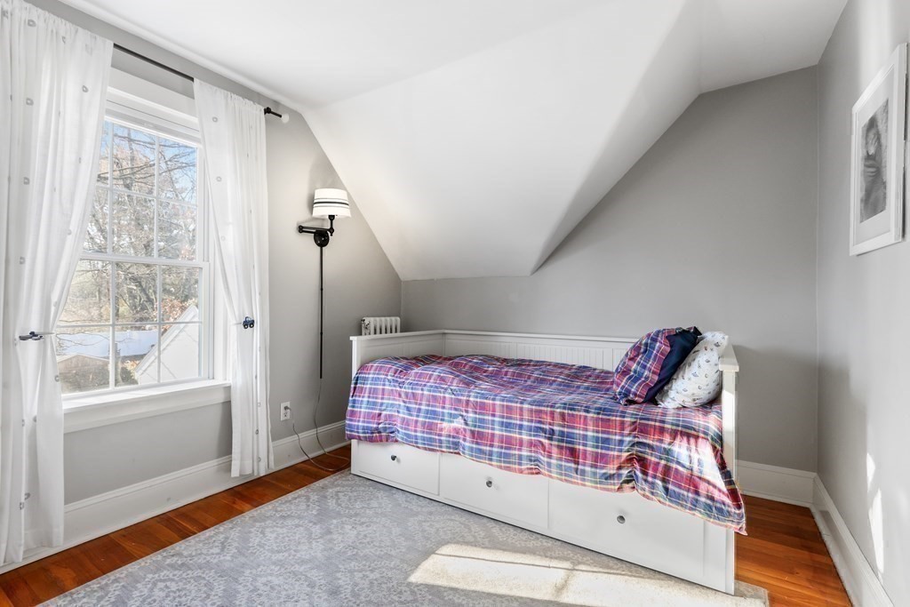 79 Kendall Lane Natick, MA 01760 - Photo 24 of 32 a bedroom with a bed and a window