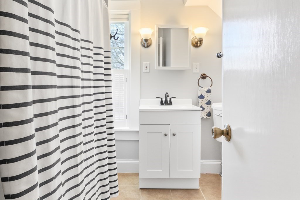 79 Kendall Lane Natick, MA 01760 - Photo 25 of 32 a bathroom with a sink and a mirror