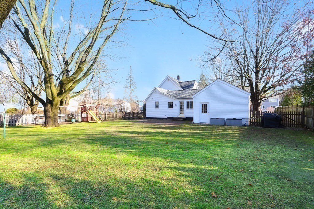 79 Kendall Lane Natick, MA 01760 - Photo 28 of 32 a front view of house with yard and trees
