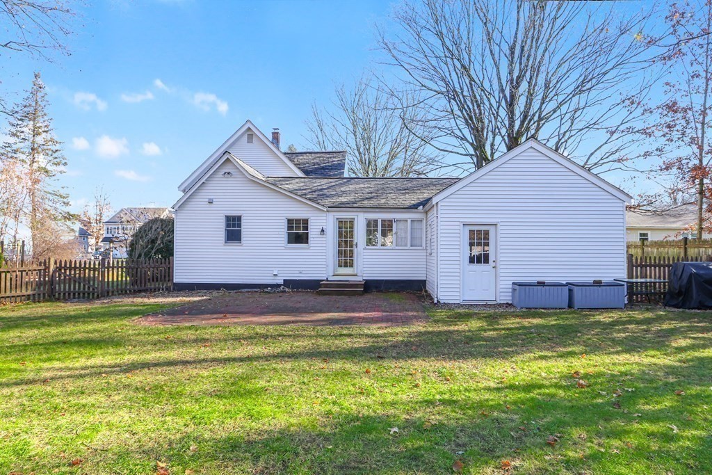 79 Kendall Lane Natick, MA 01760 - Photo 29 of 32 a view of a house with a big yard and large tree