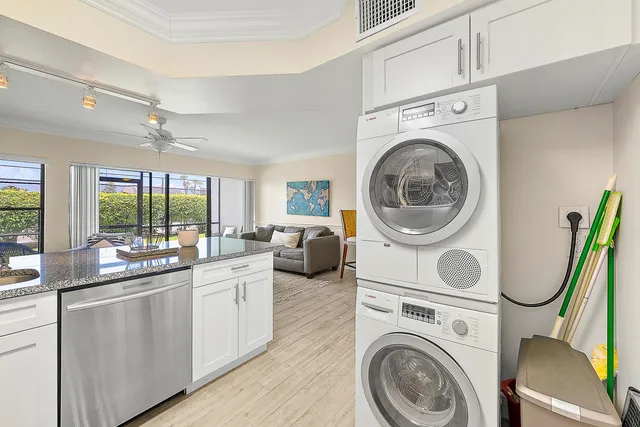 a view of a kitchen with a washer and dryer