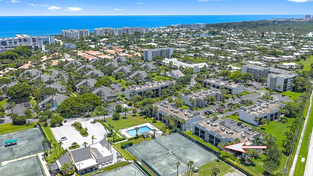 an aerial view of residential houses with outdoor space and street view