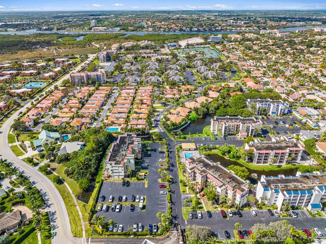 an aerial view of residential building and lake