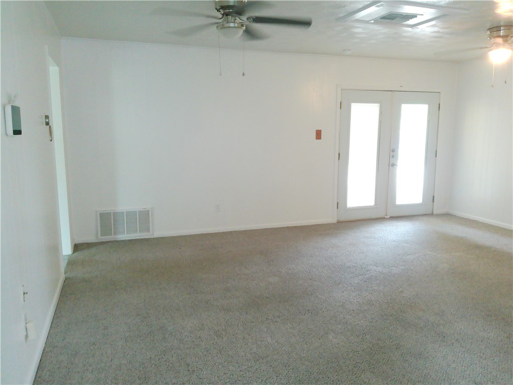 4117 Monaco Street Corpus Christi, TX 78411 - Photo 5 of 17 an empty room with a empty space and windows