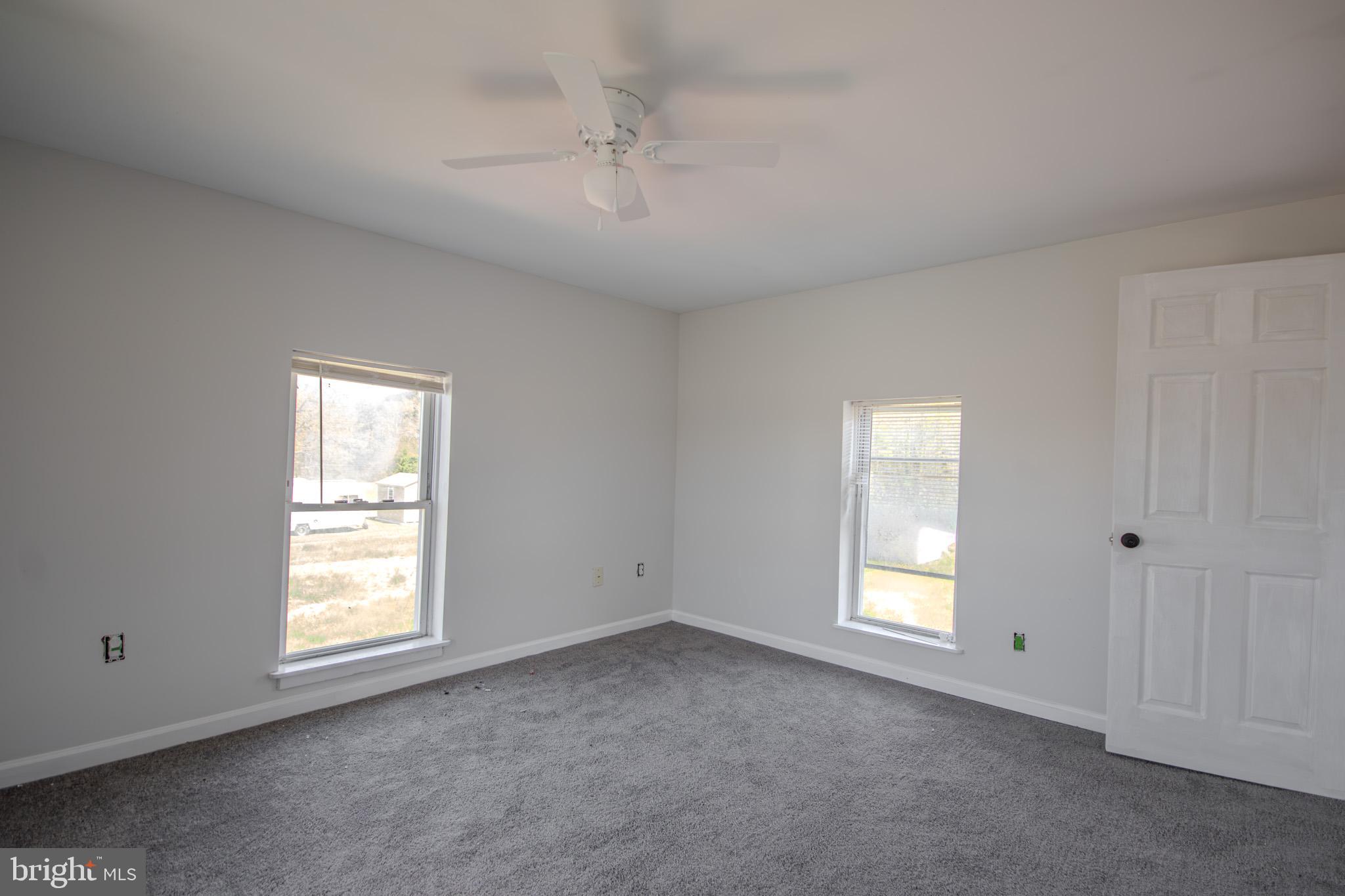 5693 Landon Store Road Marion Station, MD 21838 - Photo 17 of 20 a view of empty room with windows