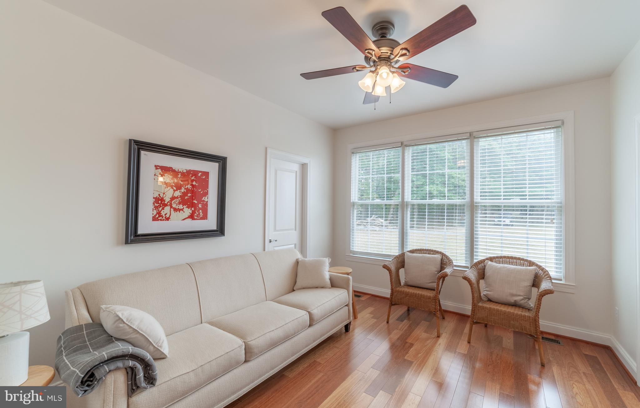 6162 Newton Road Preston, MD 21655 - Photo 22 of 38 a living room with furniture and a large window with wooden floor