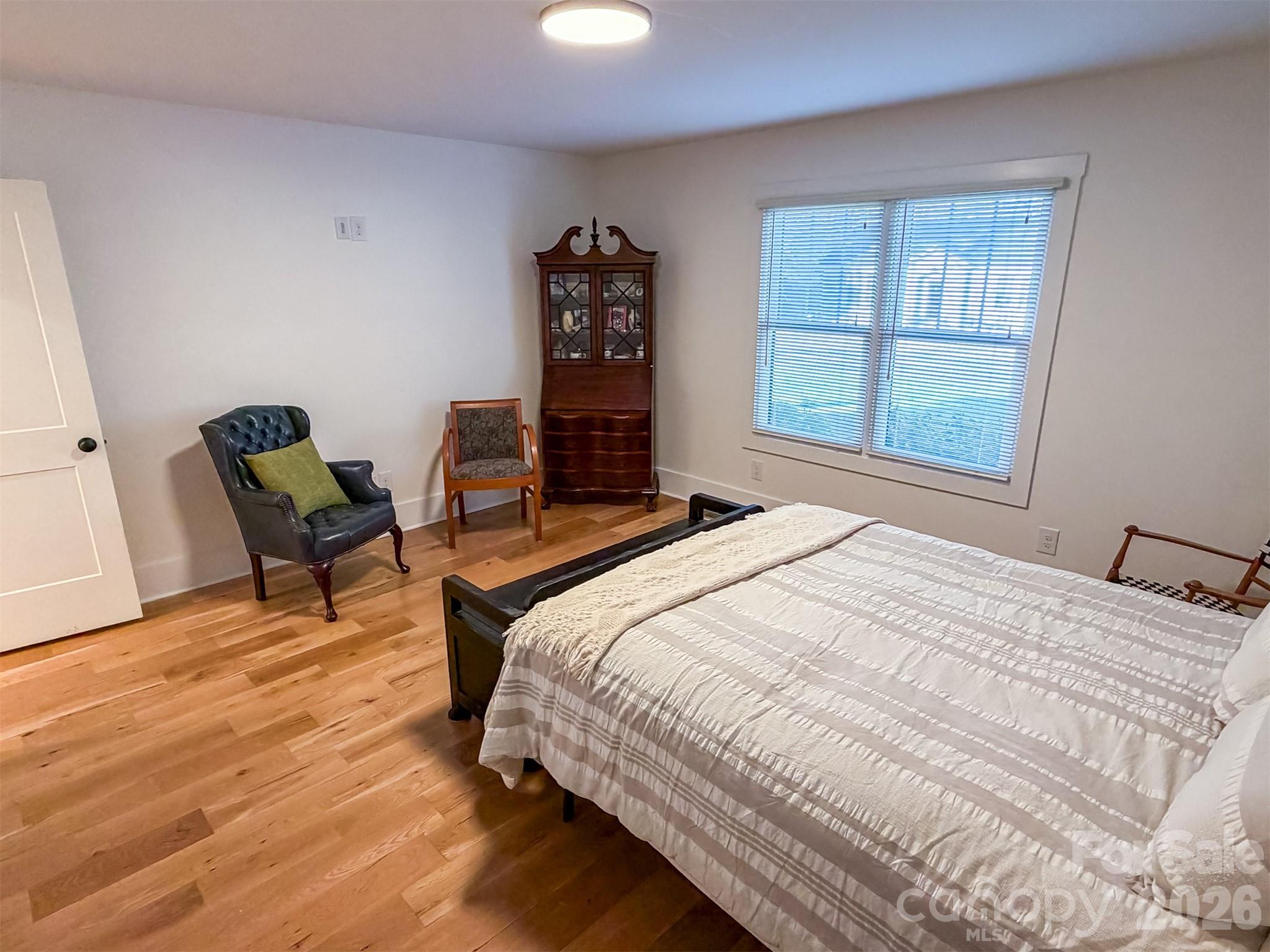 85 20th Avenue Northwest Hickory, NC 28601 - Photo 21 of 47 a bedroom with a bed a chair and a large window