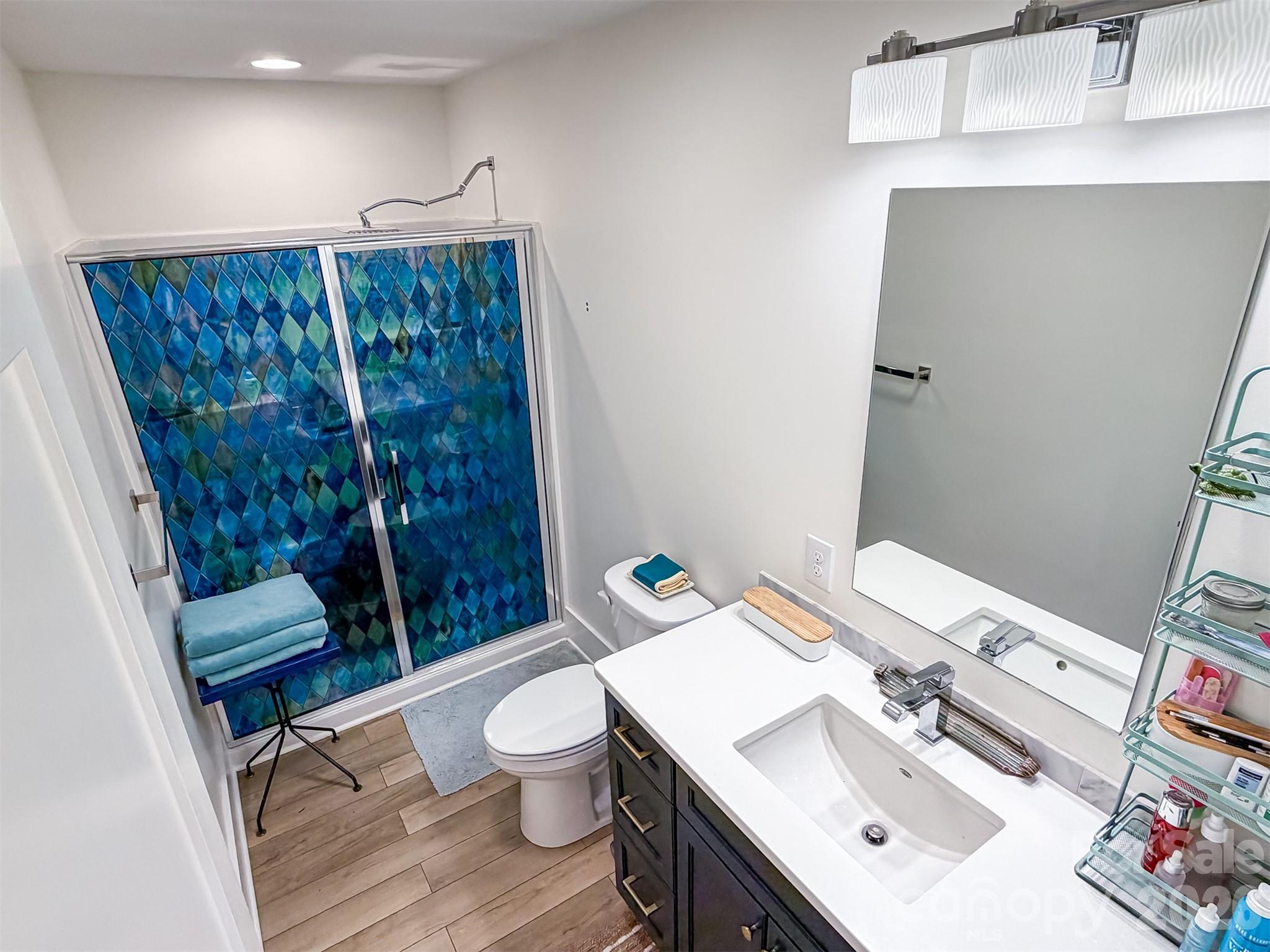 85 20th Avenue Northwest Hickory, NC 28601 - Photo 25 of 47 a bathroom with a sink a toilet and shower