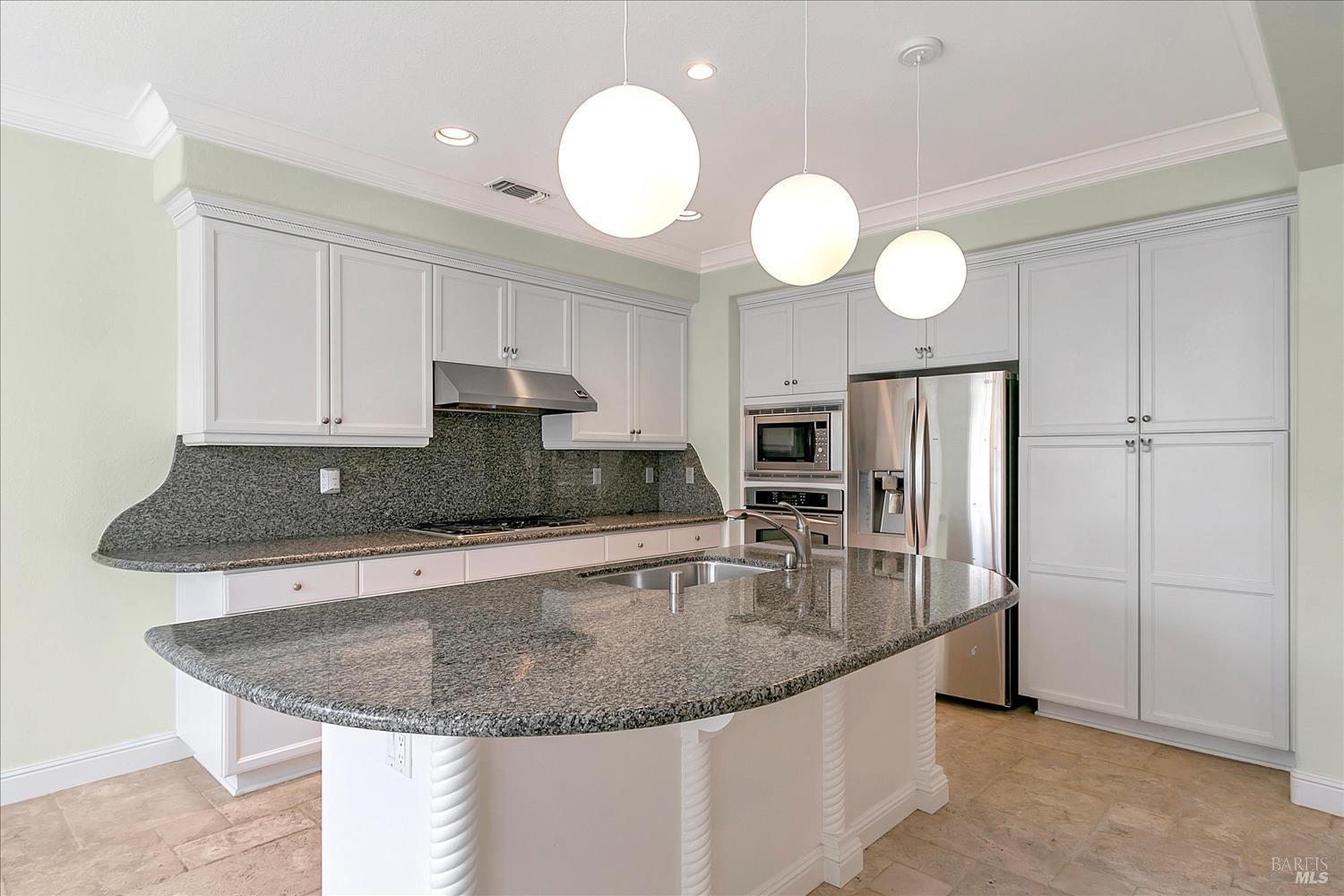 4180 Summer Gate Avenue Vallejo, CA 94591 - Photo 14 of 52 a kitchen with stainless steel appliances granite countertop a sink a refrigerator and a stove