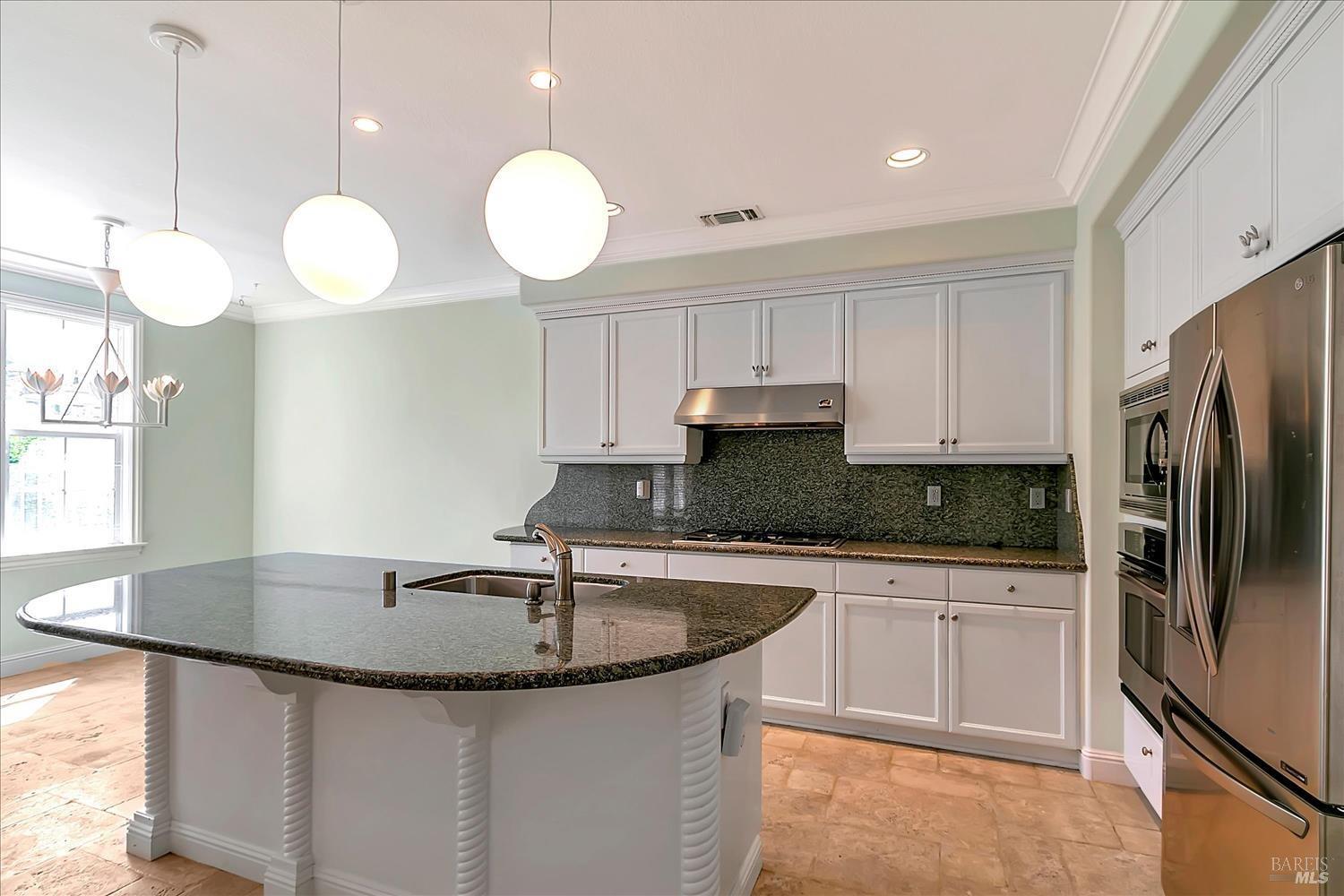 4180 Summer Gate Avenue Vallejo, CA 94591 - Photo 15 of 52 a kitchen with stainless steel appliances granite countertop a sink a refrigerator and a stove