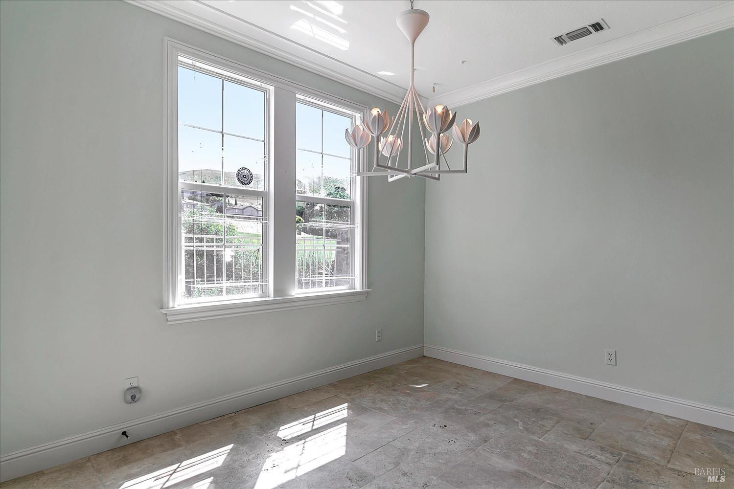 4180 Summer Gate Avenue Vallejo, CA 94591 - Photo 16 of 52 en empty room with windows and chandelier
