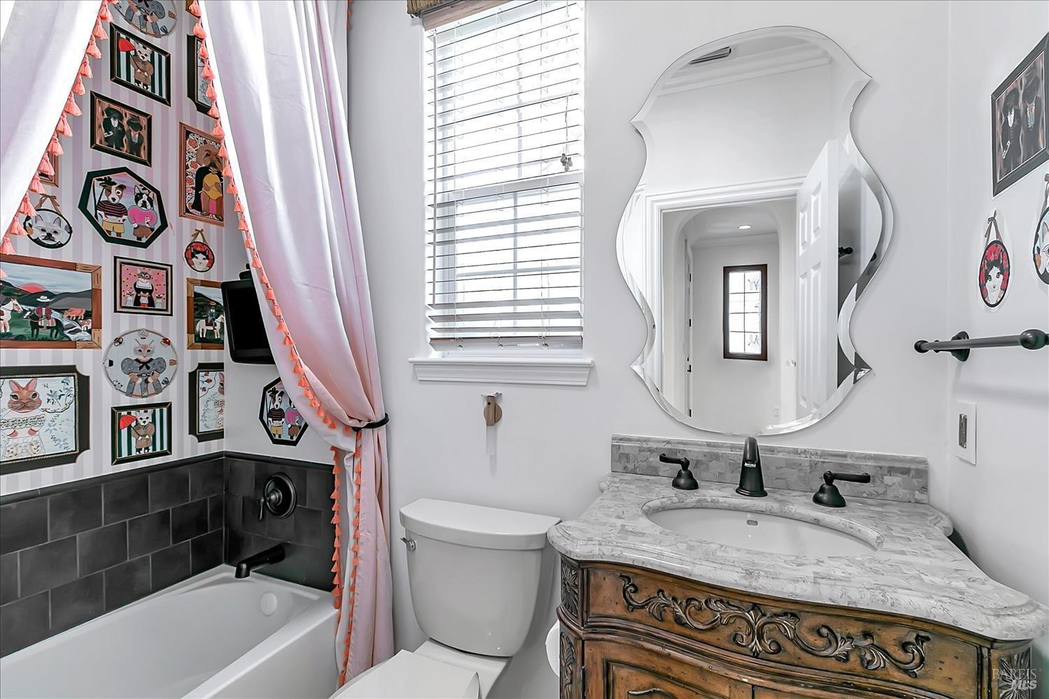 4180 Summer Gate Avenue Vallejo, CA 94591 - Photo 18 of 52 a bathroom with a granite countertop sink and a mirror