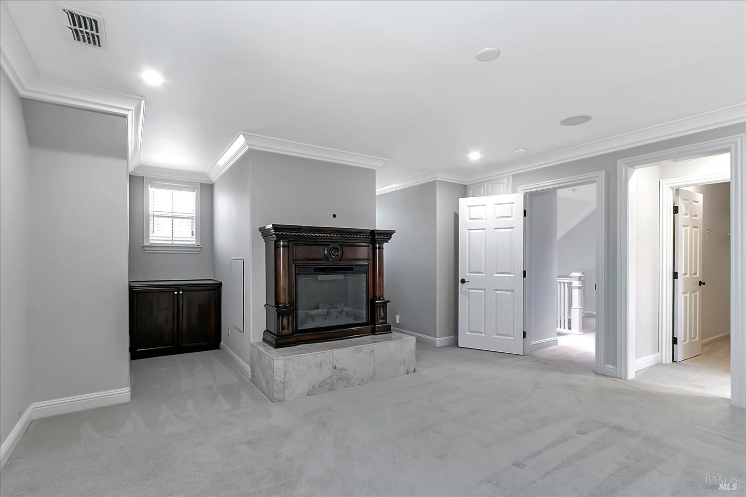 4180 Summer Gate Avenue Vallejo, CA 94591 - Photo 20 of 52 a living room with a fireplace and a walk in closet