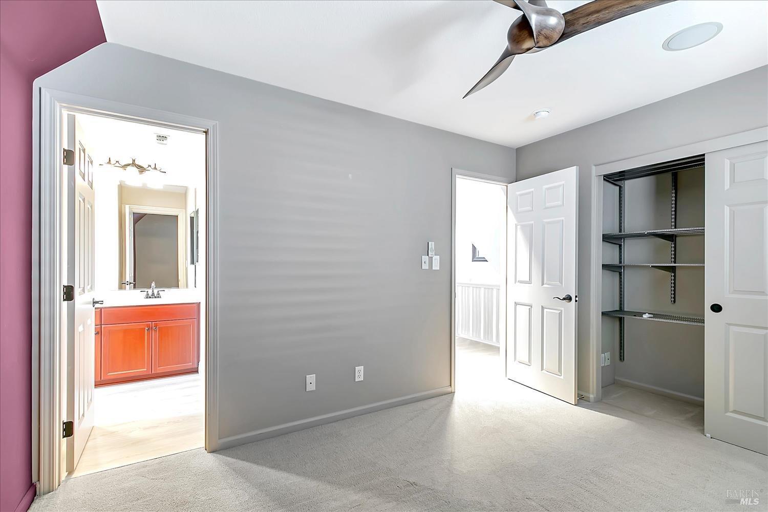 4180 Summer Gate Avenue Vallejo, CA 94591 - Photo 26 of 52 an empty room with a cabinet and mirrors
