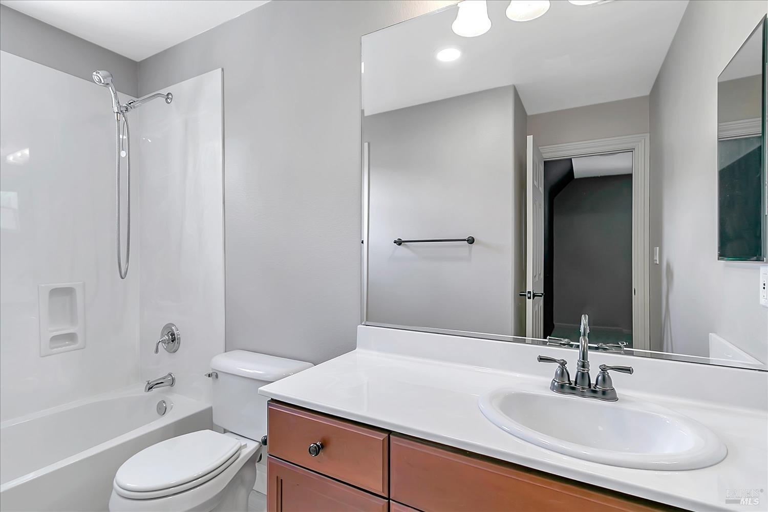 4180 Summer Gate Avenue Vallejo, CA 94591 - Photo 27 of 52 a bathroom with a sink toilet vanity and shower