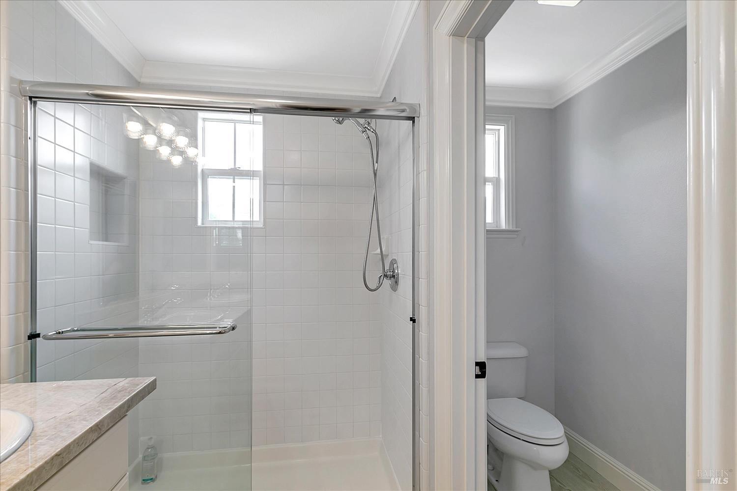 4180 Summer Gate Avenue Vallejo, CA 94591 - Photo 42 of 52 a bathroom with a granite countertop sink mirror toilet and shower