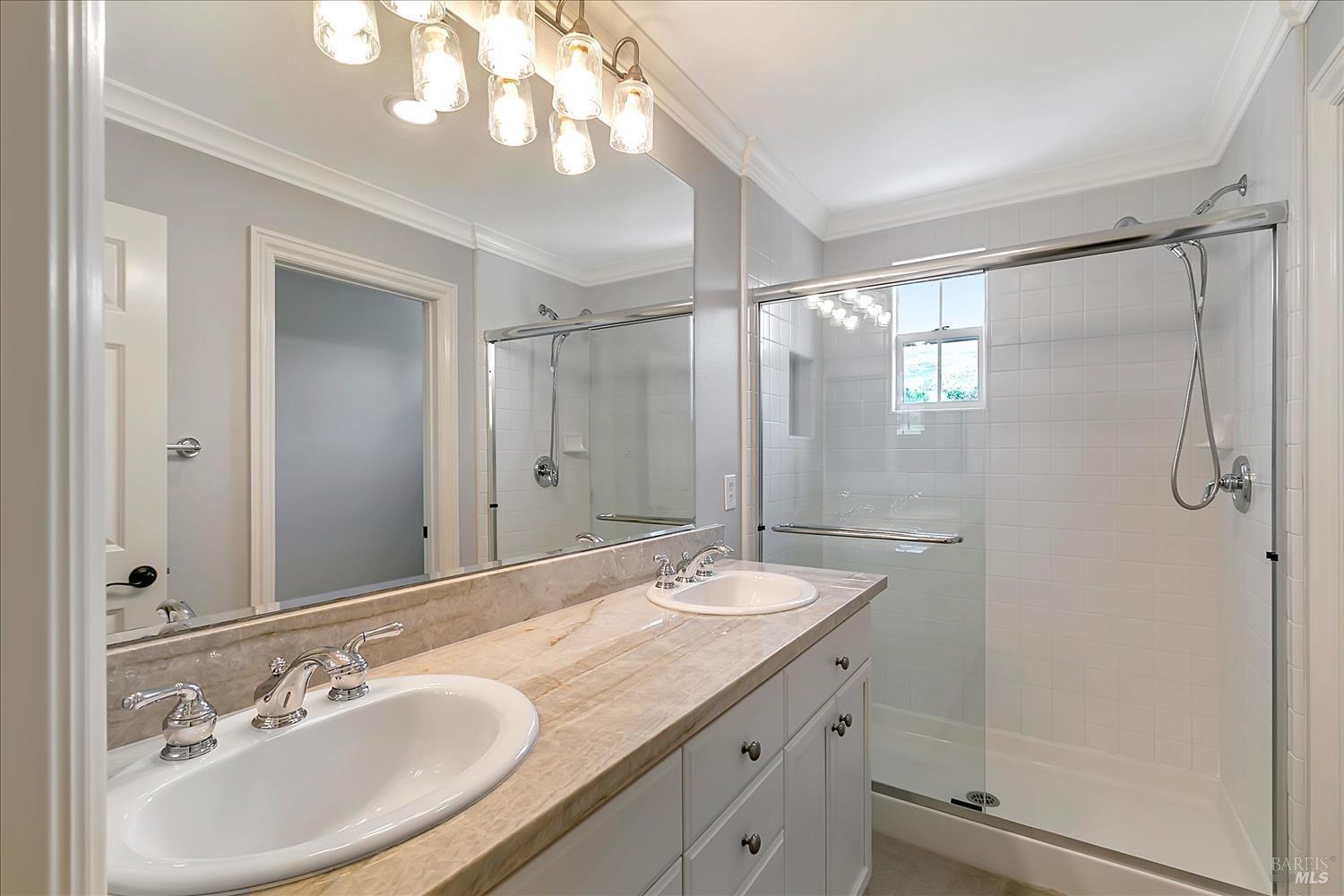 4180 Summer Gate Avenue Vallejo, CA 94591 - Photo 43 of 52 a bathroom with a granite countertop sink a mirror and a shower