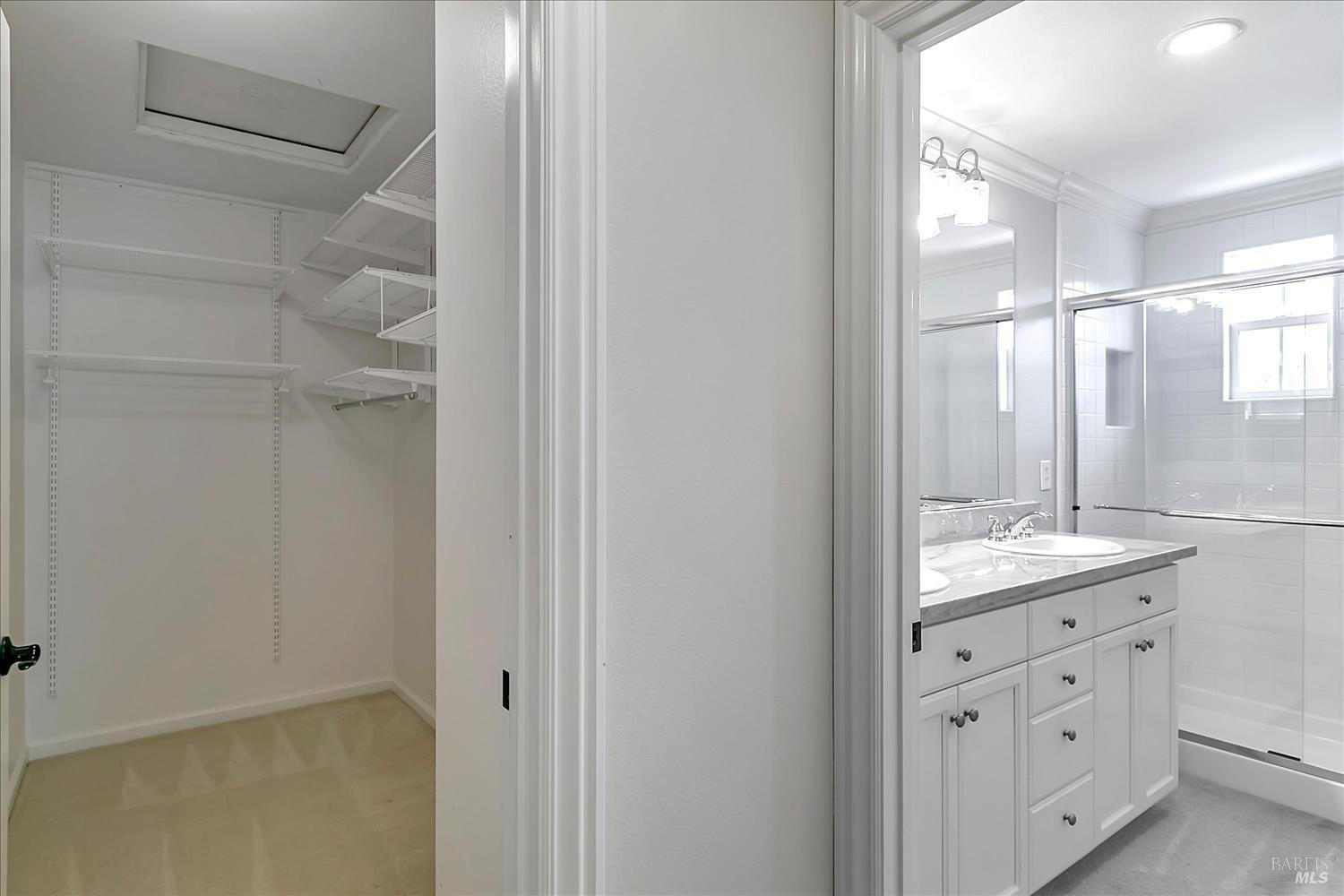 4180 Summer Gate Avenue Vallejo, CA 94591 - Photo 44 of 52 a bathroom with a granite countertop sink a mirror and a