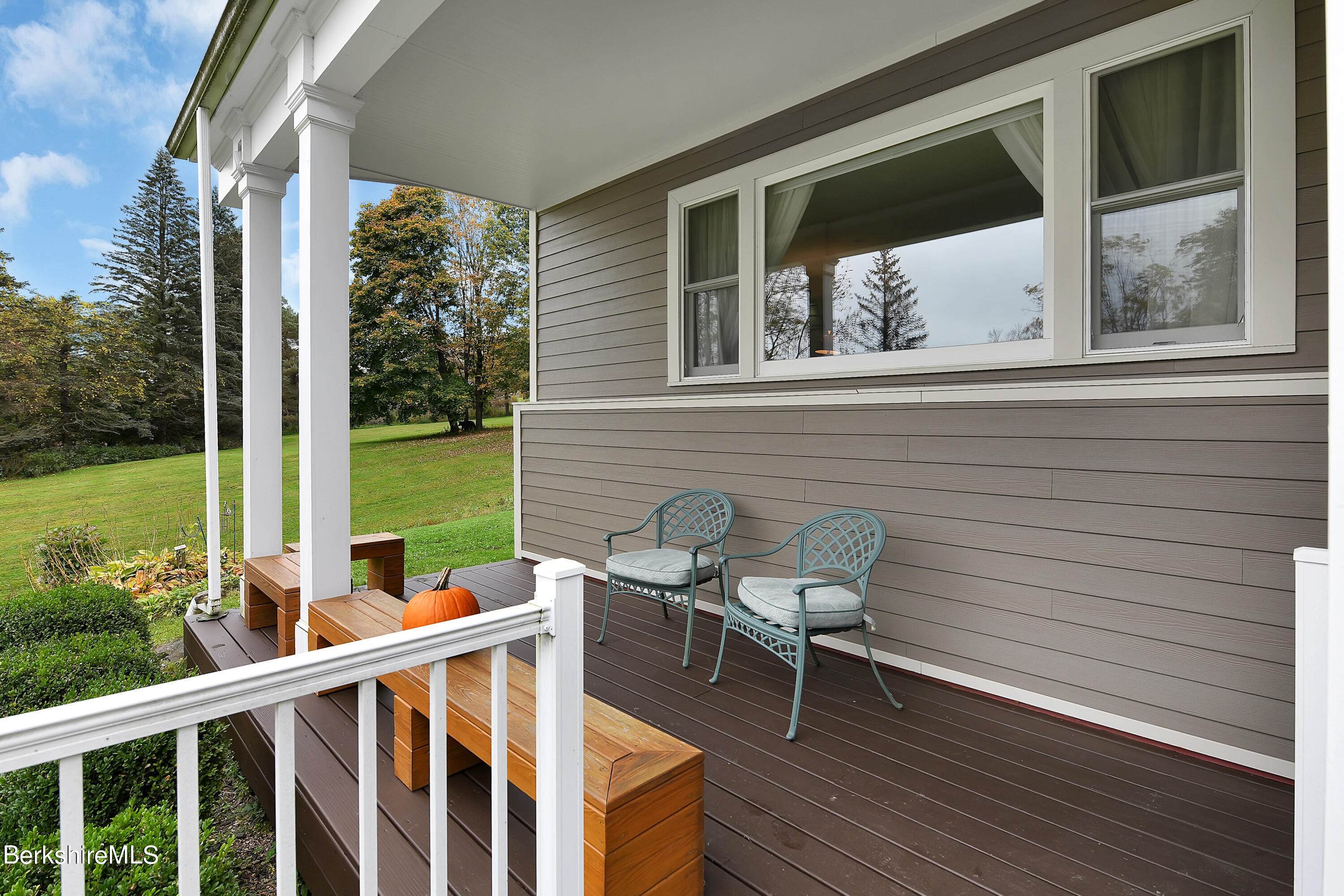 311 Yokun Road Richmond, MA 01201 - Photo 5 of 38 a view of a two chairs in the balcony