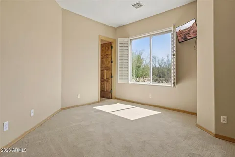 a view of an empty walk in closet