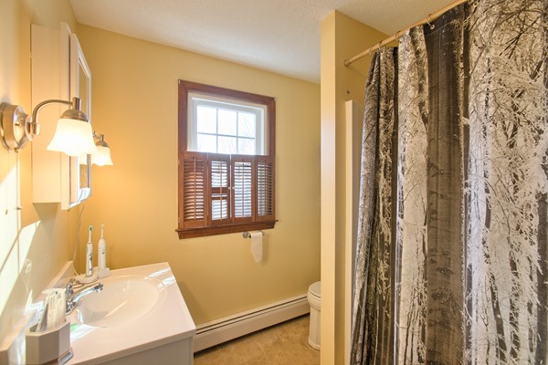 458 Johnson Street North Andover, MA 01845 - Photo 19 of 25 a view of a bathroom with a tub and shower