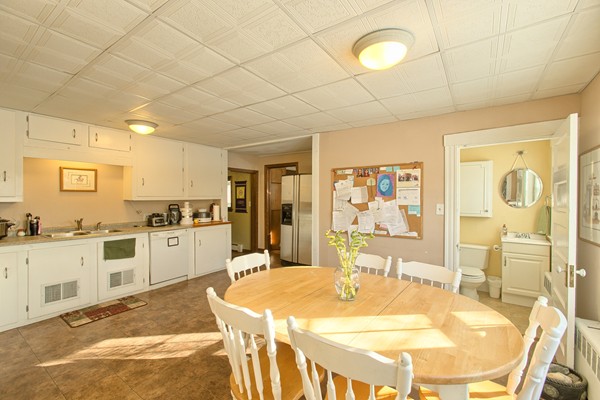 458 Johnson Street North Andover, MA 01845 - Photo 20 of 25 a large white kitchen with wooden floor