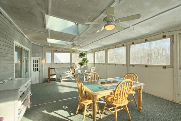 458 Johnson Street North Andover, MA 01845 - Photo 24 of 25 a dining room with furniture a chandelier and a rug