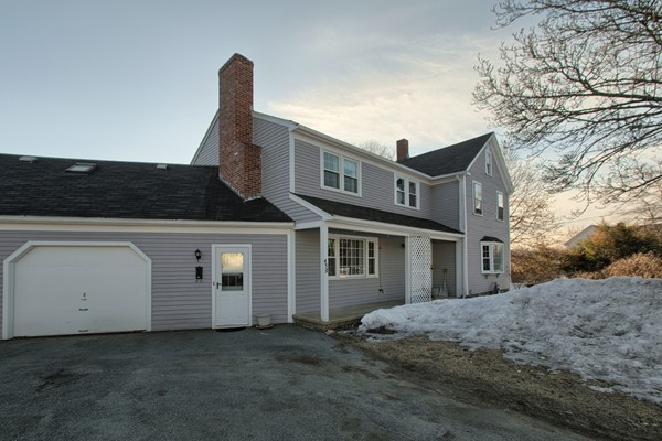458 Johnson Street North Andover, MA 01845 - Photo 3 of 25 a front view of a house with a yard