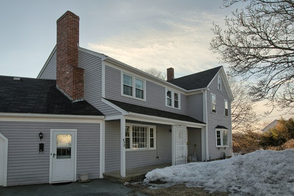 458 Johnson Street North Andover, MA 01845 - Photo 4 of 25 a front view of a house with a yard