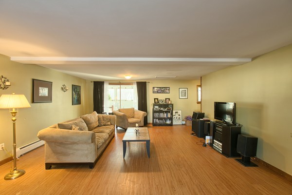 458 Johnson Street North Andover, MA 01845 - Photo 9 of 25 a living room with furniture and a flat screen tv