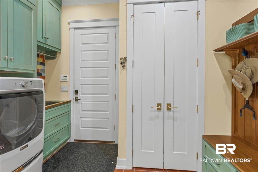 2730 Gator Road Mobile, AL 36605 - Photo 25 of 42 Laundry room featuring washer / dryer and cabinet space