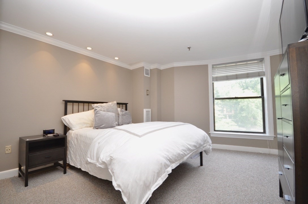 390 Commonwealth Avenue, Unit 210 Boston, MA 02215 - Photo 11 of 19 a bedroom with a bed and a window