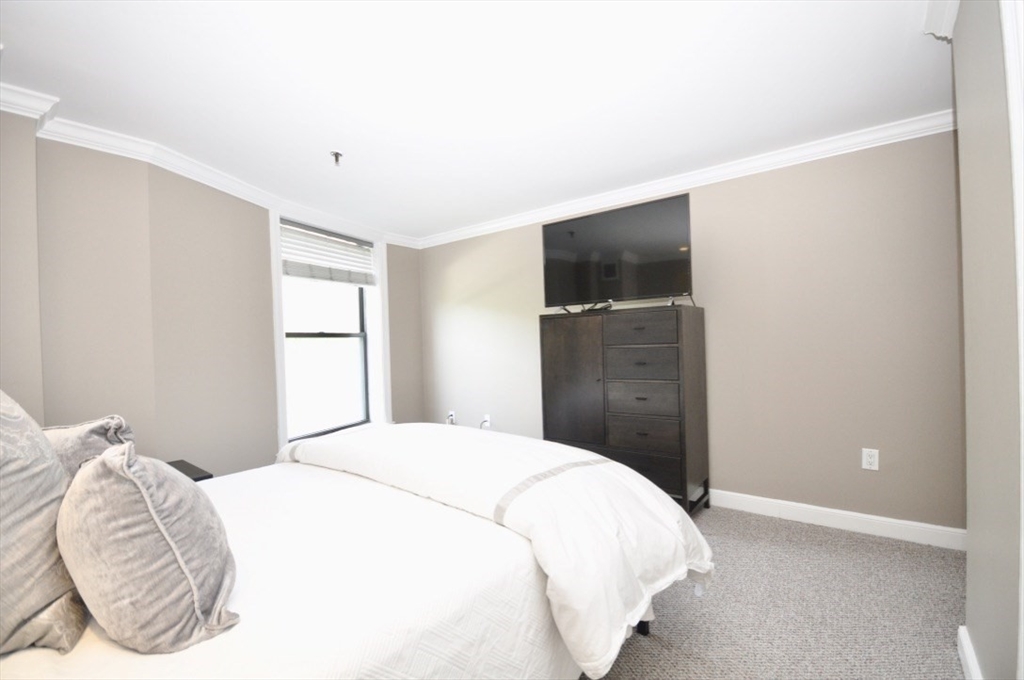 390 Commonwealth Avenue, Unit 210 Boston, MA 02215 - Photo 13 of 19 a bedroom with a bed and a window