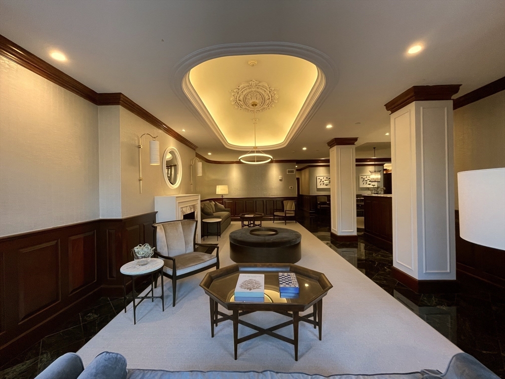 390 Commonwealth Avenue, Unit 210 Boston, MA 02215 - Photo 16 of 19 a living room with furniture and a wooden floor