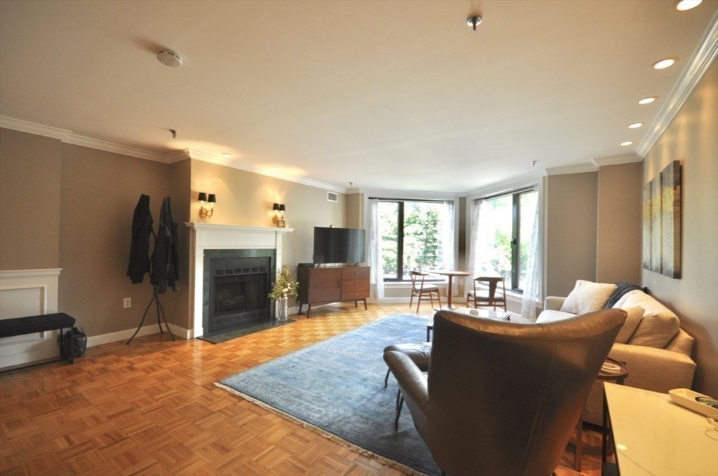 390 Commonwealth Avenue, Unit 210 Boston, MA 02215 - Photo 5 of 19 a living room with furniture kitchen view and a large window