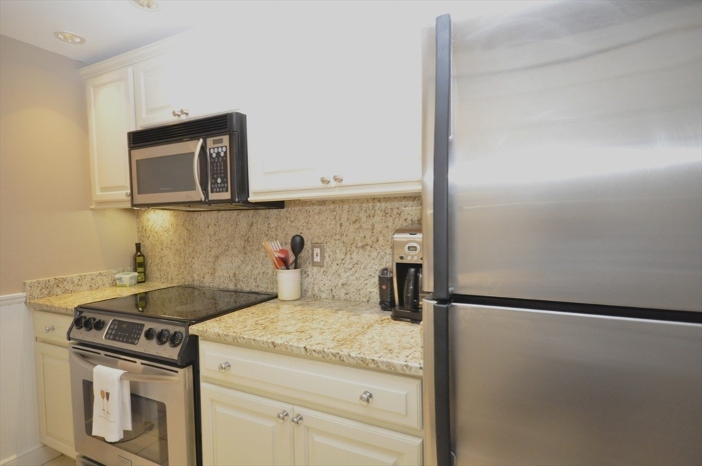 390 Commonwealth Avenue, Unit 210 Boston, MA 02215 - Photo 8 of 19 a kitchen with a stove and a sink