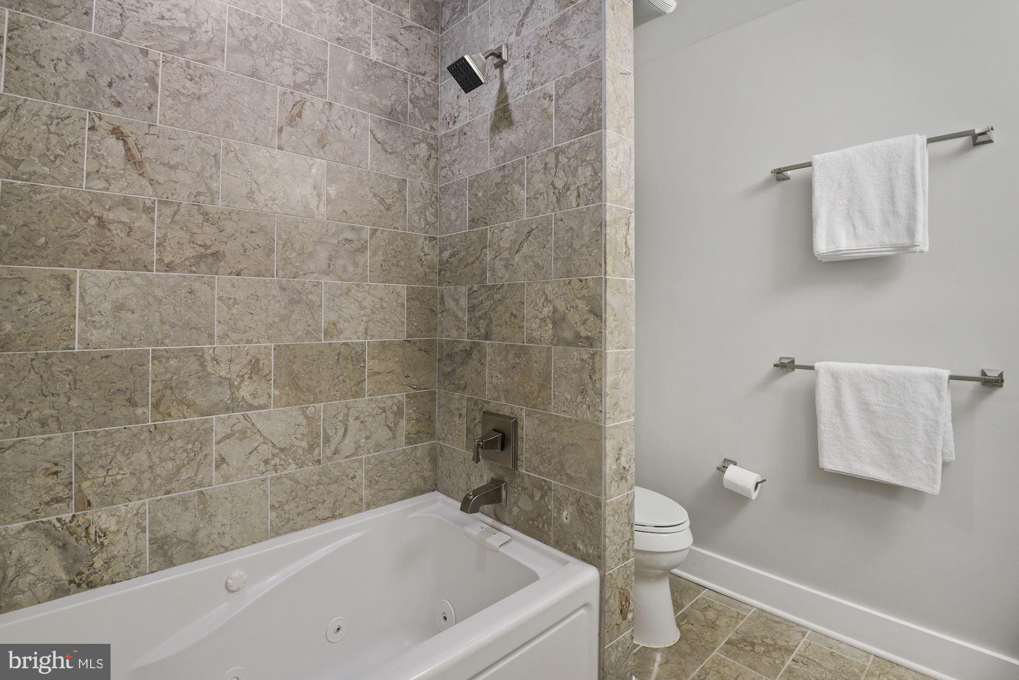 73 U Street Northwest, Unit 1 Washington, DC 20001 - Photo 18 of 30 a bathroom with a bathtub