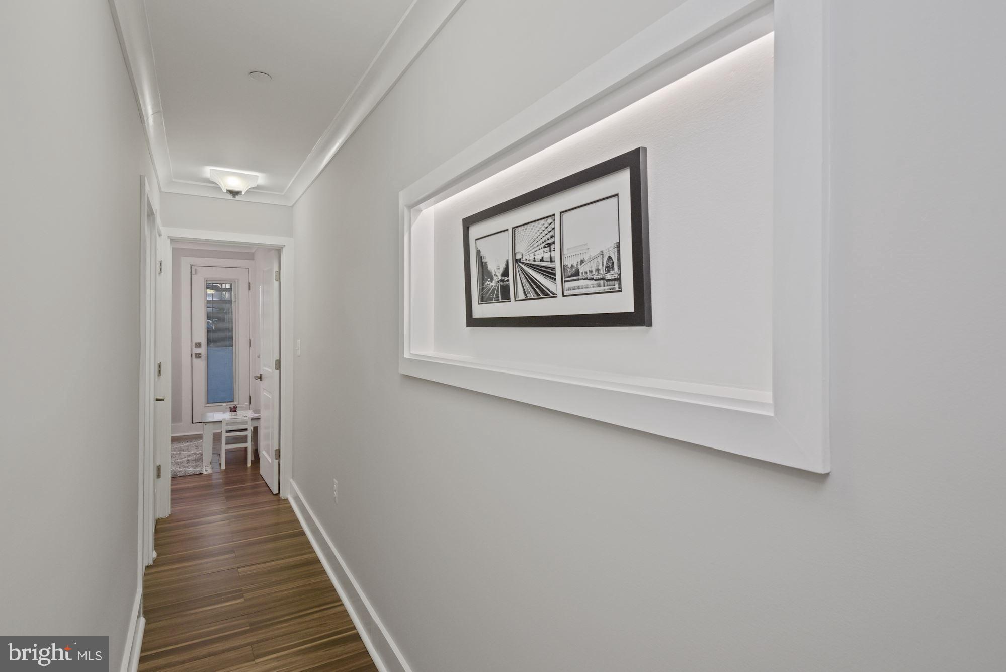 73 U Street Northwest, Unit 1 Washington, DC 20001 - Photo 20 of 30 a view of a hallway with wooden floor
