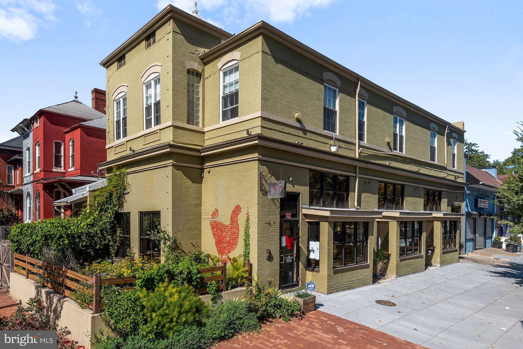 73 U Street Northwest, Unit 1 Washington, DC 20001 - Photo 28 of 30 a front view of a house with a lots of windows