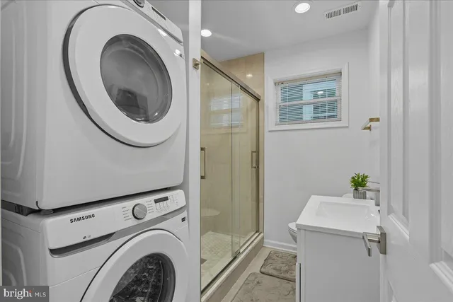 a utility room with dryer and washer